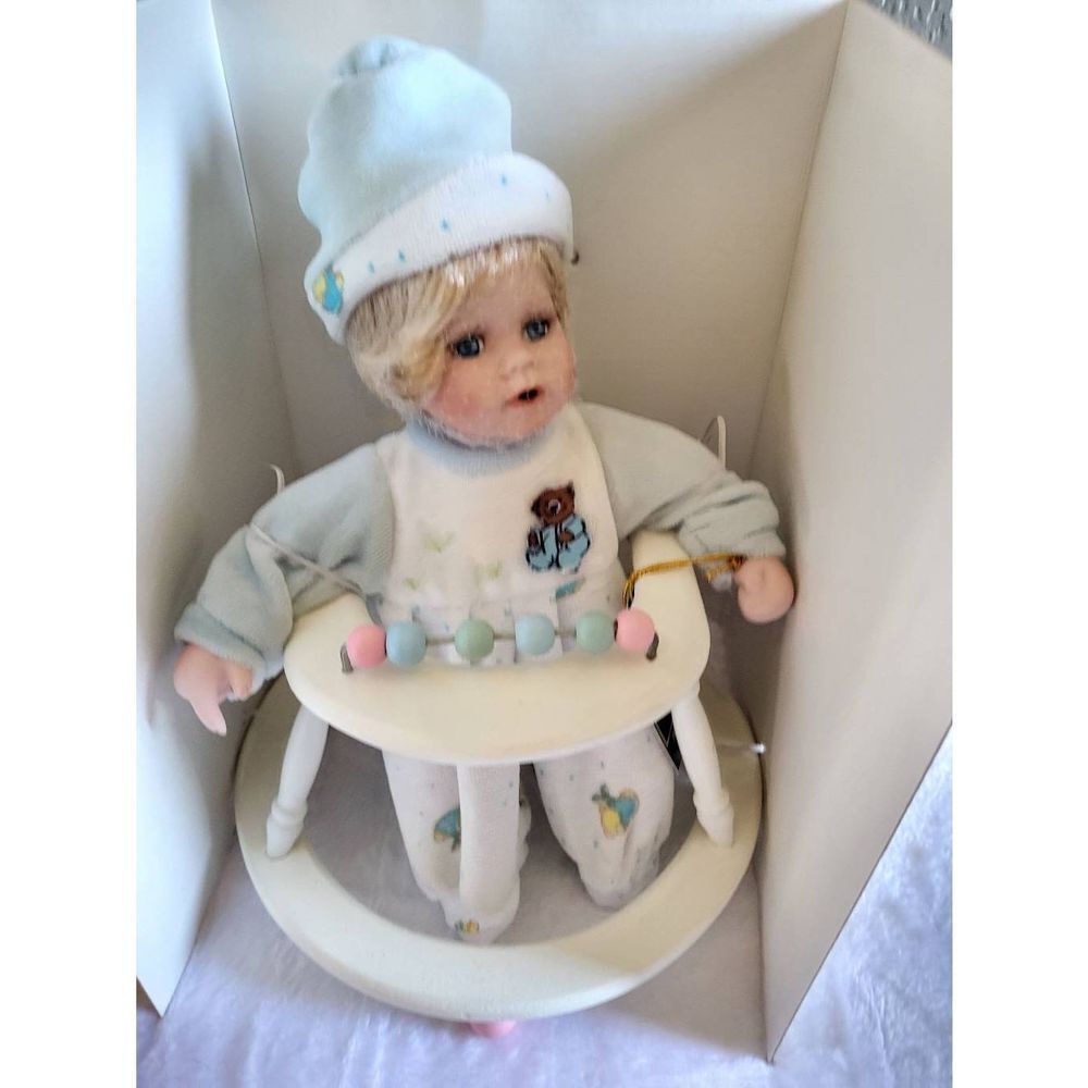 Geppeddo porcelain doll in walker